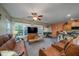 Living room with leather sofas, large TV, and access to the kitchen at 3001 Parkwest Boulevard, Mount Pleasant, SC 29466