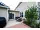 Private patio with seating area, brick pavers, and mature shrubs at 3001 Parkwest Boulevard, Mount Pleasant, SC 29466