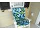 White rocking chair with tropical leaf cushion on porch at 3001 Parkwest Boulevard, Mount Pleasant, SC 29466