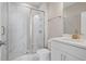 Elegant bathroom features marble tile shower, frameless glass door, and white vanity at 351 Wappoo Trace Ln, Summerville, SC 29486