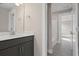 Bathroom with a single sink vanity and tub shower, featuring gray cabinets and modern fixtures at 351 Wappoo Trace Ln, Summerville, SC 29486