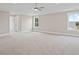 Large bedroom with plush carpet, a ceiling fan, and natural light from two windows at 351 Wappoo Trace Ln, Summerville, SC 29486