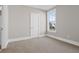 Cozy bedroom with neutral carpet, bright window, and white trim at 351 Wappoo Trace Ln, Summerville, SC 29486