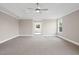 Spacious bedroom boasts a tray ceiling, recessed lighting, and serene view of the connected bathroom at 351 Wappoo Trace Ln, Summerville, SC 29486