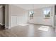 Bright dining room features wainscoting, hardwood floors, and natural light from two windows at 351 Wappoo Trace Ln, Summerville, SC 29486