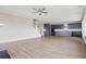 Open-concept living space with hardwood floors, staircase, and a modern kitchen with gray cabinetry at 351 Wappoo Trace Ln, Summerville, SC 29486