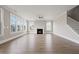 Spacious living room features hardwood floors, a fireplace, large windows and a ceiling fan at 351 Wappoo Trace Ln, Summerville, SC 29486