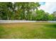 Large grassy backyard enclosed by a tall wooden fence at 362 6Th Ave, Mount Pleasant, SC 29464