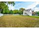 Spacious grassy backyard with tall fence and detached garage at 362 6Th Ave, Mount Pleasant, SC 29464