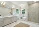 Spa-like bathroom with double vanity, soaking tub, and shower at 362 6Th Ave, Mount Pleasant, SC 29464