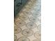 Close-up of a bathroom floor featuring unique tile work in a pattern with eye-catching design and neutral colors at 362 6Th Ave, Mount Pleasant, SC 29464