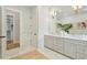 Bright bathroom featuring double vanity, neutral cabinets, and access to walk-in closet at 362 6Th Ave, Mount Pleasant, SC 29464