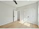 Bedroom with hardwood floors, closet, and an open doorway at 362 6Th Ave, Mount Pleasant, SC 29464