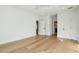Open bedroom with white walls, multiple doorways, and light hardwood floors, creating a bright and spacious atmosphere at 362 6Th Ave, Mount Pleasant, SC 29464