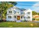 Two story white house with a covered porch and manicured lawn at 362 6Th Ave, Mount Pleasant, SC 29464