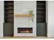 Modern living room fireplace with built-in shelving and a sleek design at 362 6Th Ave, Mount Pleasant, SC 29464