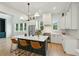 Spacious kitchen with white cabinets, marble island, and high-end appliances at 362 6Th Ave, Mount Pleasant, SC 29464