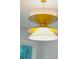 Close-up of a modern gold and white light fixture at 362 6Th Ave, Mount Pleasant, SC 29464