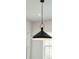 Close-up of a modern black pendant light fixture at 362 6Th Ave, Mount Pleasant, SC 29464
