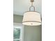 Close-up of a modern white pendant light fixture at 362 6Th Ave, Mount Pleasant, SC 29464