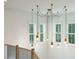 Unique light fixture with multiple pendants in a stairwell at 362 6Th Ave, Mount Pleasant, SC 29464