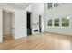 Spacious living room with hardwood floors and a modern fireplace at 362 6Th Ave, Mount Pleasant, SC 29464