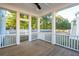 Relaxing screened porch with wooden deck and backyard access at 362 6Th Ave, Mount Pleasant, SC 29464