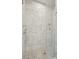White marble shower with rainfall shower head and built-in toiletry shelf at 362 6Th Ave, Mount Pleasant, SC 29464