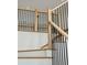 Staircase with wood steps and railings featuring black iron balusters at 362 6Th Ave, Mount Pleasant, SC 29464