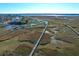 Drone view showing waterfront community with marsh access and private piers at 363 Clayton Dr, Charleston, SC 29414