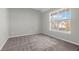 Spacious bedroom with large window, neutral walls, and carpeted floor at 363 Clayton Dr, Charleston, SC 29414