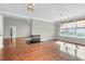 Bright dining room with hardwood floors, fireplace, and large windows at 363 Clayton Dr, Charleston, SC 29414