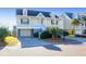 Two-story house with front porch, attached garage, and landscaped yard at 363 Clayton Dr, Charleston, SC 29414