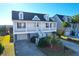 Two-story house with front porch, attached garage, and landscaped yard at 363 Clayton Dr, Charleston, SC 29414