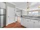 Modern kitchen with white cabinets, stainless steel appliances and access to the dining area at 363 Clayton Dr, Charleston, SC 29414