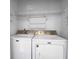 Laundry room with Maytag washer and dryer and overhead shelving at 363 Clayton Dr, Charleston, SC 29414