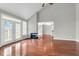 Open living room with hardwood floors, fireplace, and views into the kitchen and dining areas at 363 Clayton Dr, Charleston, SC 29414