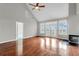 Spacious living room featuring hardwood floors, a fireplace, and access to a deck with scenic views at 363 Clayton Dr, Charleston, SC 29414