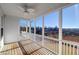 Bright screened porch with wooden floors and water views at 363 Clayton Dr, Charleston, SC 29414