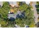 Top-down view of a house with a large deck surrounded by trees at 420 E Erie Ave, Folly Beach, SC 29439