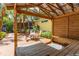 Relaxing backyard patio with covered seating area and tropical landscaping at 420 E Erie Ave, Folly Beach, SC 29439