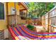 Relaxing backyard with hammock and patio furniture at 420 E Erie Ave, Folly Beach, SC 29439
