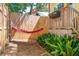 Charming backyard oasis featuring a colorful hammock at 420 E Erie Ave, Folly Beach, SC 29439