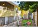 Landscaped backyard with bocce ball court and outdoor shower at 420 E Erie Ave, Folly Beach, SC 29439