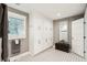 Modern bathroom with white cabinets, patterned tile floor and a large mirror at 420 E Erie Ave, Folly Beach, SC 29439