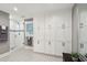 Spa-like bathroom with white cabinets, patterned tile floor and a large shower at 420 E Erie Ave, Folly Beach, SC 29439