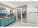 Elegant bathroom with dual vanity, a large walk-in shower, and stylish tile at 420 E Erie Ave, Folly Beach, SC 29439