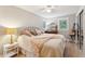 Bedroom with light walls, a metal bed frame, and mirrored closet doors at 420 E Erie Ave, Folly Beach, SC 29439