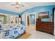 Spacious bedroom with wood dresser, blue walls and access to a large closet at 420 E Erie Ave, Folly Beach, SC 29439
