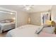 Cozy bedroom with light walls, a metal bed frame, and mirrored closet doors at 420 E Erie Ave, Folly Beach, SC 29439